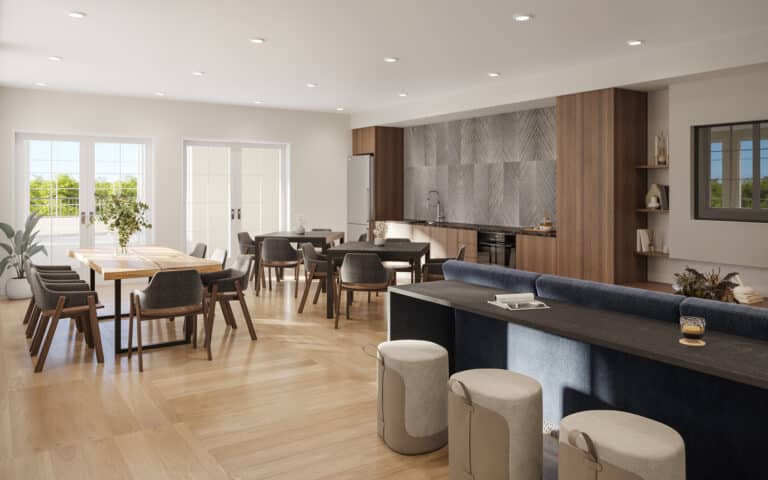 Villa Rotonda clubhouse are with round, white bar stools, black bar table, and 3 raw-wood tables surrounded by gray chairs