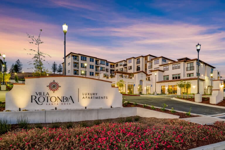 Villa Rotonda Apartments in Santa Rosa twilight front entrance sign.
